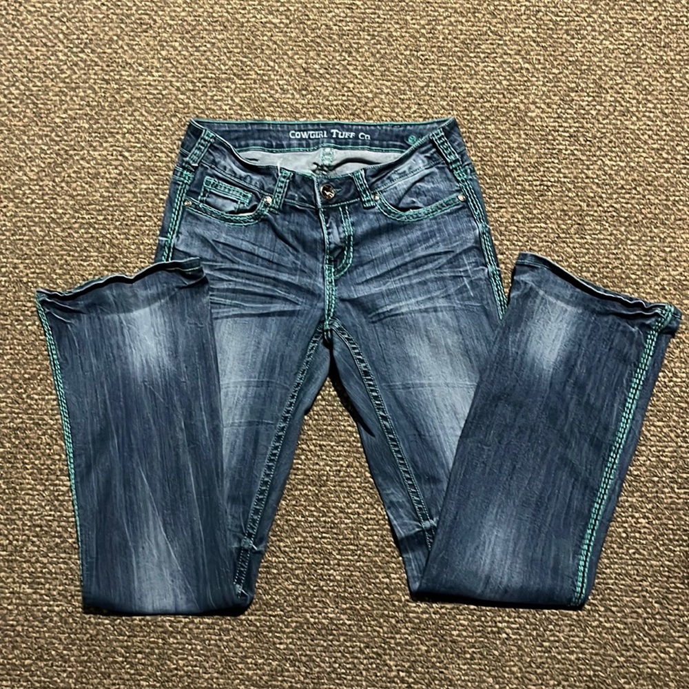 Great condition cowgirl Tuff jeans with teal stitching